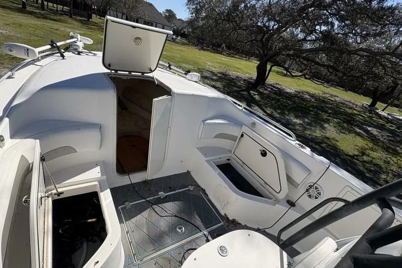 Slide: The Image of 2008 Wellcraft 35 Scarab Sport boat interior with open storage compartments. - 33