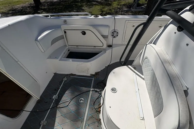 Slide: The Image of 2008 Wellcraft 35 Scarab Sport boat interior with seating and storage compartments. - 36
