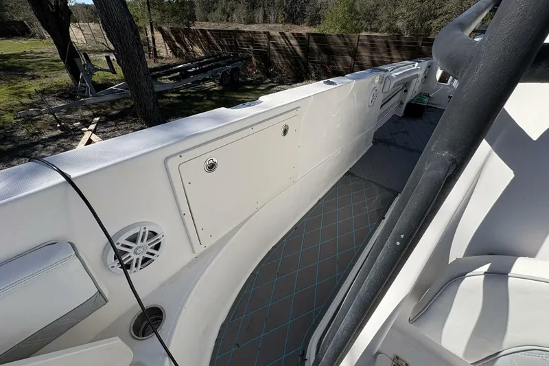 Slide: The Image of 2008 Wellcraft 35 Scarab Sport boat interior with seating and storage compartments. - 38