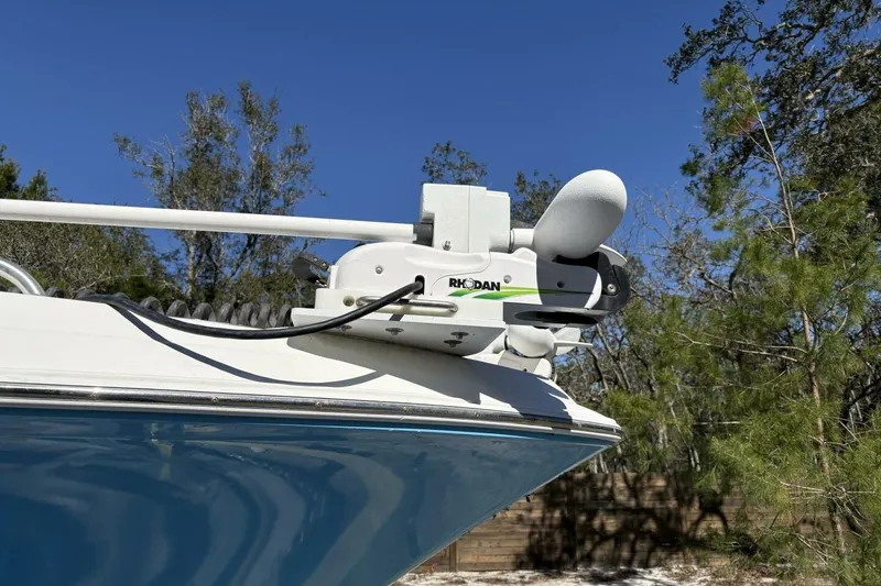 Slide: The Image of 2008 Wellcraft 35 Scarab Sport boat with Rhodan trolling motor, blue hull, sunny day. - 4