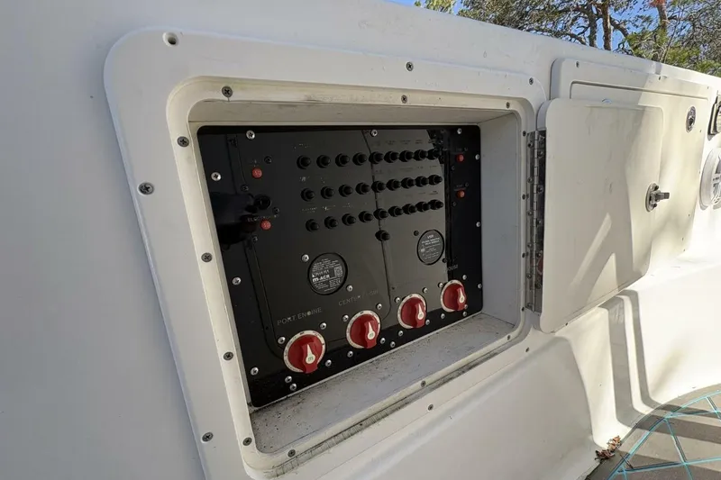 Slide: The Image of Electrical panel on a 2008 Wellcraft 35 Scarab Sport boat, featuring multiple switches and controls. - 40
