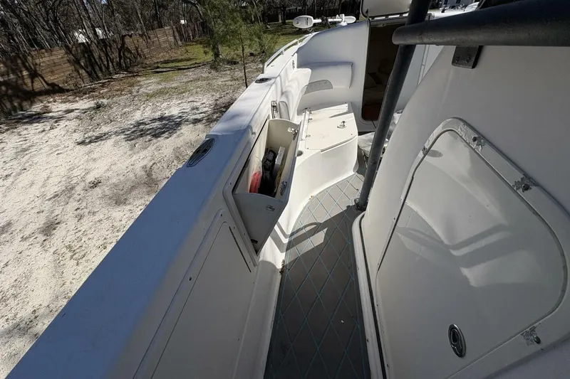 Slide: The Image of 2008 Wellcraft 35 Scarab Sport boat interior with open storage compartment. - 42