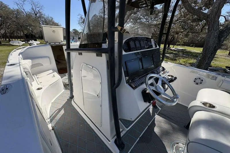 Slide: The Image of 2008 Wellcraft 35 Scarab Sport boat interior with steering console and seating. - 43