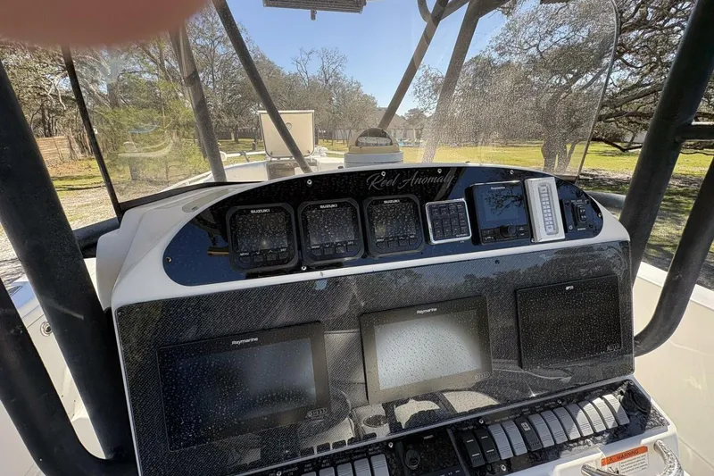 Slide: The Image of 2008 Wellcraft 35 Scarab Sport dashboard with navigation and control panels. - 50