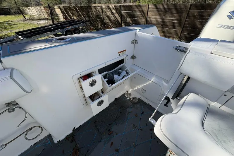 Slide: The Image of 2008 Wellcraft 35 Scarab Sport boat interior with storage compartments and seating. - 59