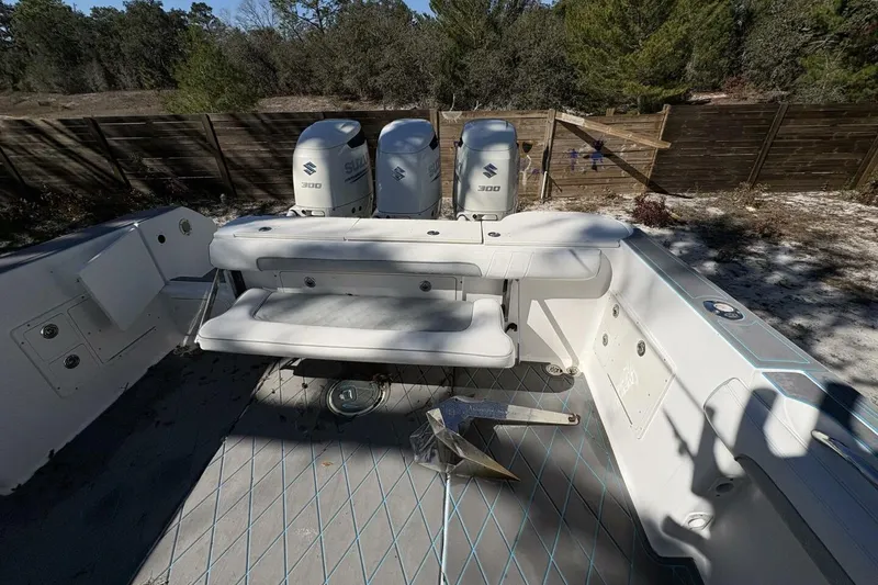 Slide: The Image of 2008 Wellcraft 35 Scarab Sport boat interior with Suzuki engines and anchor on deck. - 63