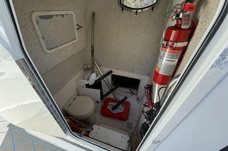 Slide: The Image of Interior of 2008 Wellcraft 35 Scarab Sport boat with toilet and fire extinguisher. - 67