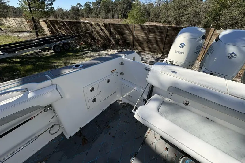 Slide: The Image of 2008 Wellcraft 35 Scarab Sport boat interior with Suzuki 300 engines, outdoor setting. - 80