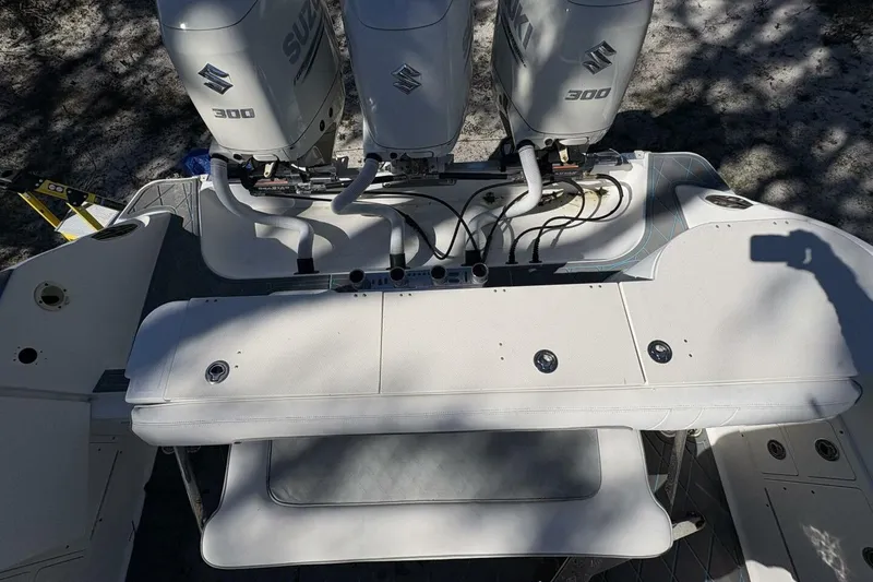 Slide: The Image of 2008 Wellcraft 35 Scarab Sport boat with triple Suzuki 300 engines, viewed from above. - 87
