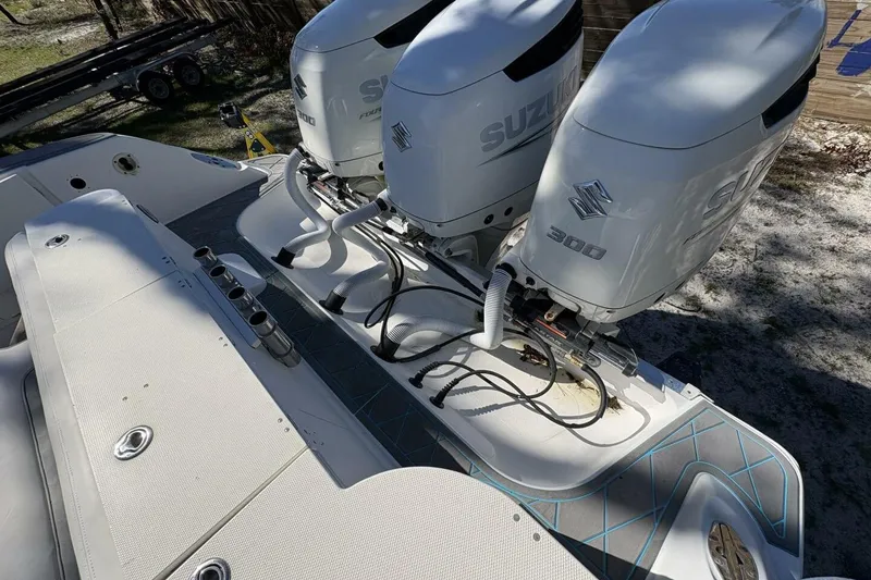 Slide: The Image of 2008 Wellcraft 35 Scarab Sport with triple Suzuki 300 engines, top view. - 90