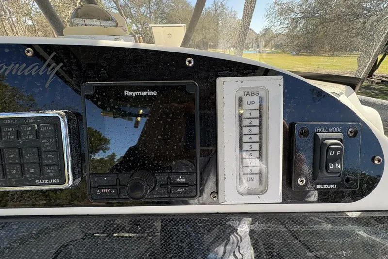 Slide: The Image of 2008 Wellcraft 35 Scarab Sport dashboard with Raymarine and Suzuki controls. - 92