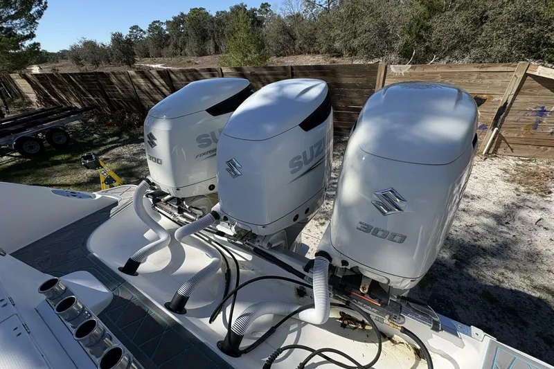 Slide: The Image of Triple Suzuki 300 outboard engines on a 2008 Wellcraft 35 Scarab Sport boat. - 94