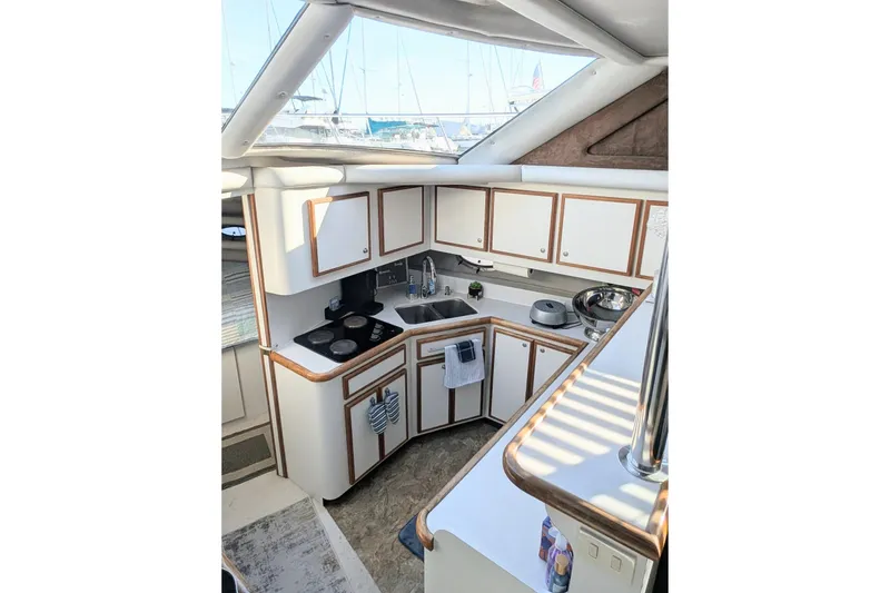 Slide: The Image of 1994 Cruisers Yachts 3850 Aft Cabin kitchen with modern amenities and ample storage. - 13