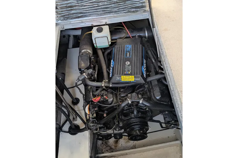Slide: The Image of Engine compartment of 1994 Cruisers Yachts 3850 Aft Cabin, featuring MerCruiser engine. - 16