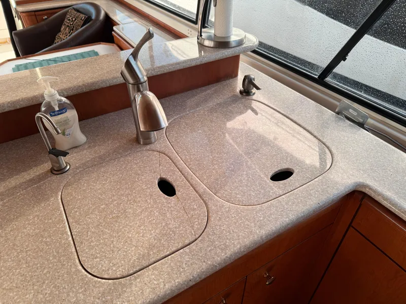 Slide: The Image of Kitchen sink area in a 2003 Meridian 490 Pilothouse yacht. - 13