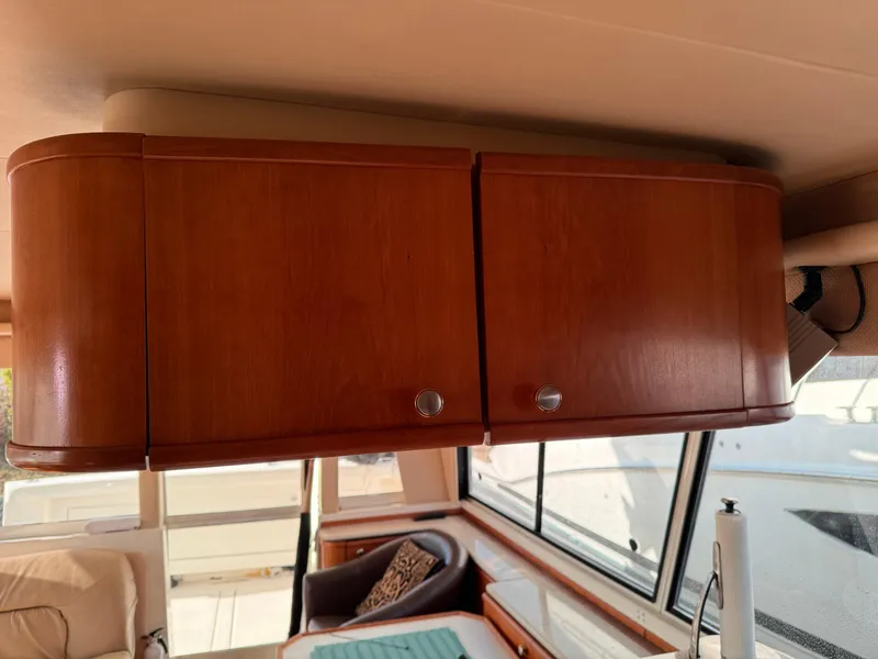 Slide: The Image of Wooden cabinets inside a 2003 Meridian 490 Pilothouse yacht interior. - 15