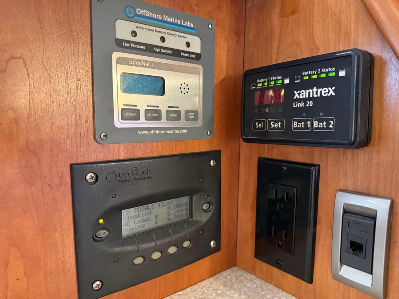 Slide: The Image of Control panels and outlets on a 2003 Meridian 490 Pilothouse yacht. - 19