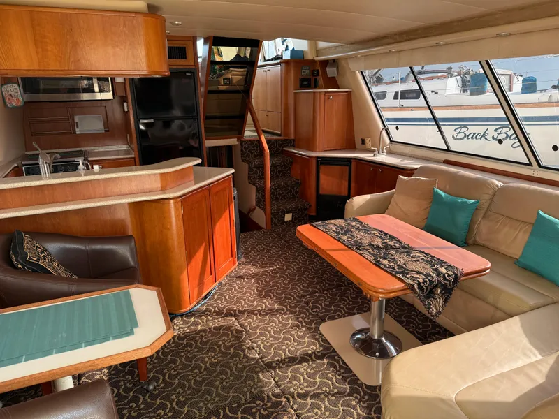 Slide: The Image of Luxurious interior of 2003 Meridian 490 Pilothouse yacht with elegant furnishings. - 2