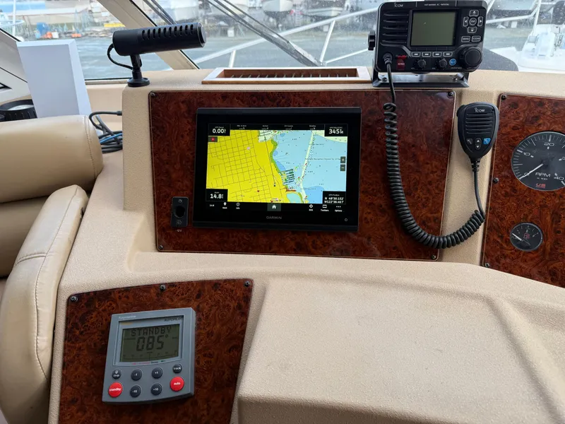 Slide: The Image of 2003 Meridian 490 Pilothouse dashboard with navigation equipment and controls. - 22