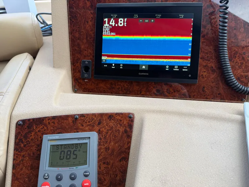 Slide: The Image of Control panel of 2003 Meridian 490 Pilothouse with navigation and depth display. - 23