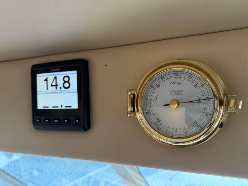 Slide: The Image of Digital display and barometer on 2003 Meridian 490 Pilothouse yacht dashboard. - 27