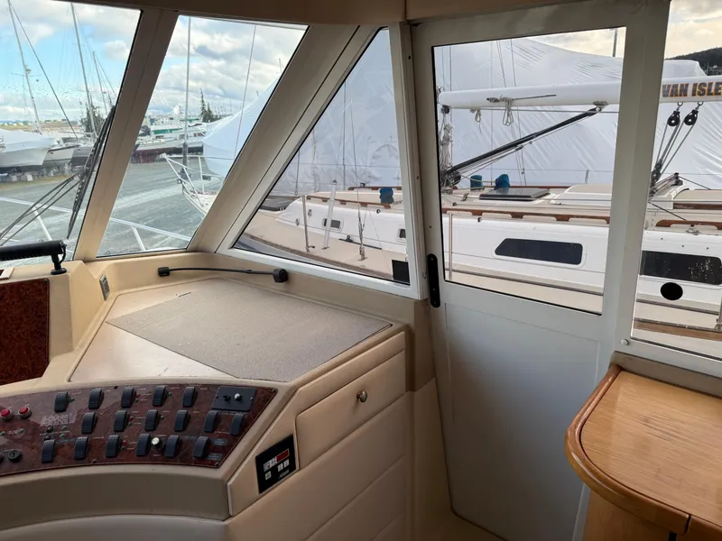 Slide: The Image of Interior view of 2003 Meridian 490 Pilothouse yacht with control panel and windows. - 33