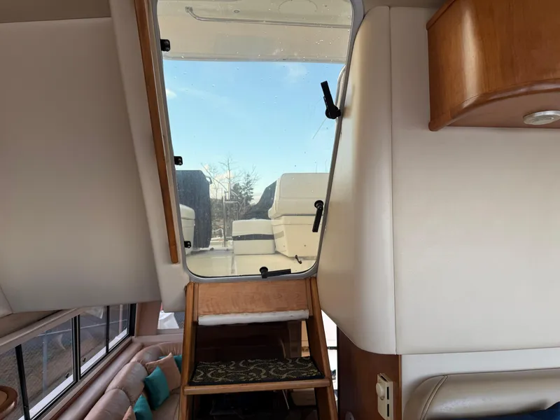 Slide: The Image of Interior view of 2003 Meridian 490 Pilothouse yacht with stairs leading to upper deck. - 35