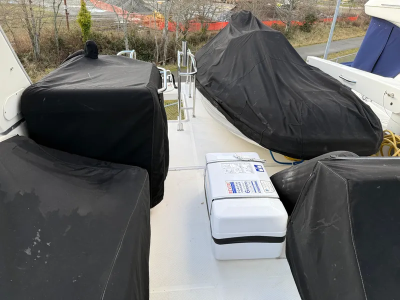 Slide: The Image of 2003 Meridian 490 Pilothouse deck with covered equipment and storage box. - 49