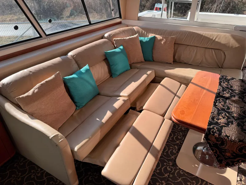 Slide: The Image of Luxurious interior of 2003 Meridian 490 Pilothouse with beige leather seating and turquoise cushions. - 5