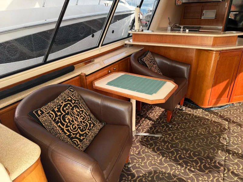 Slide: The Image of Interior of 2003 Meridian 490 Pilothouse with elegant seating and decorative pillows. - 6