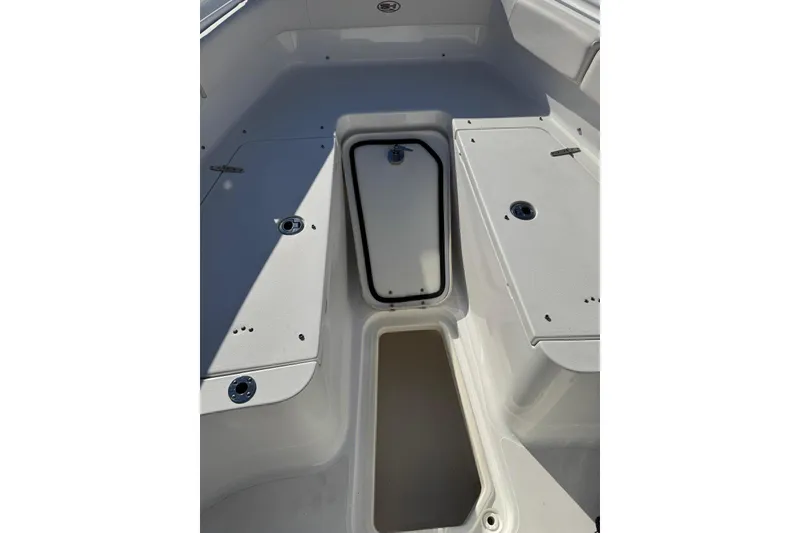 Slide: The Image of 2022 Sea Hunt Gamefish 27 Forward Seating interior with storage compartments. - 11