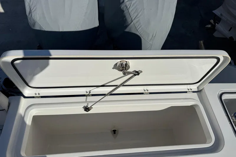 Slide: The Image of Open storage compartment on 2022 Sea Hunt Gamefish 27 Forward Seating boat. - 14