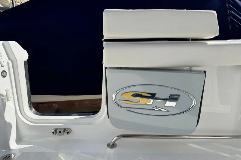 Slide: The Image of 2022 Sea Hunt Gamefish 27 Forward Seating boat detail with logo and seating. - 22