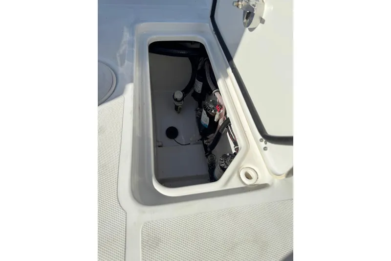 Slide: The Image of Open storage compartment on 2022 Sea Hunt Gamefish 27 Forward Seating boat. - 23