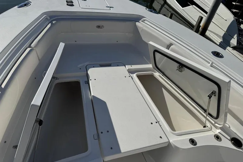 Slide: The Image of 2022 Sea Hunt Gamefish 27 Forward Seating with open storage compartments. - 8