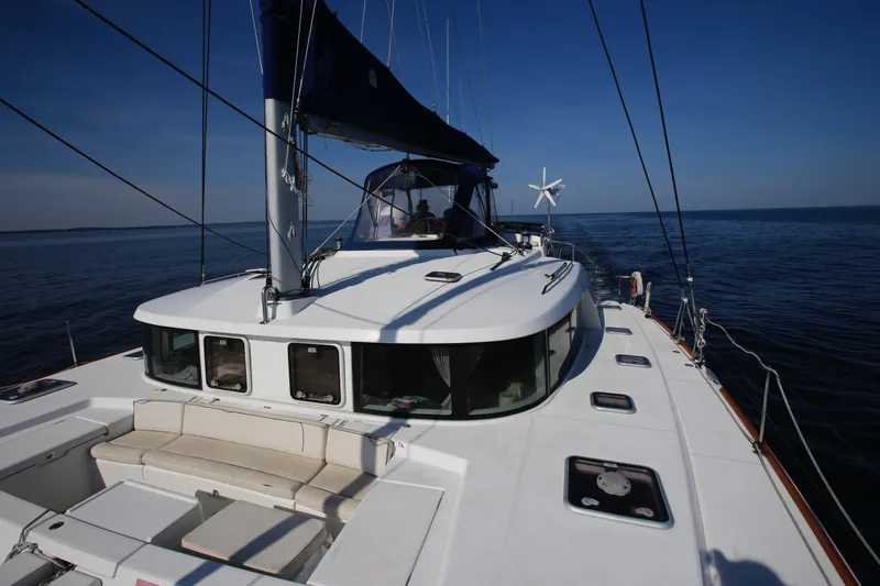 Slide: The Image of 2008 Lagoon 440 catamaran sailing on calm blue waters under clear skies. - 31