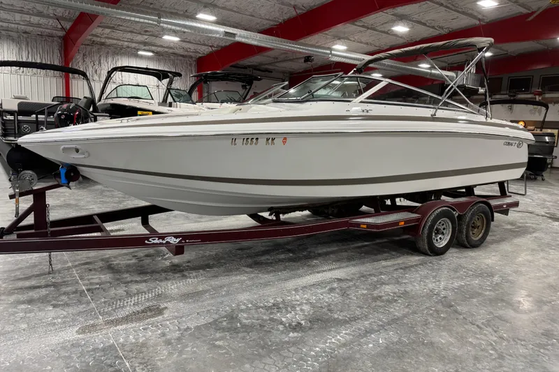 Slide: The Image of Interior of a 2000 Cobalt 246 boat with white and beige seating. - 11