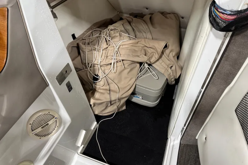 Slide: The Image of 2000 Cobalt 246 interior with beige cover and portable toilet. - 12