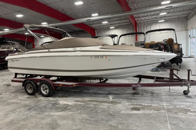 Slide: The Image of 2000 Cobalt 246 boat on trailer in indoor storage facility. - 4