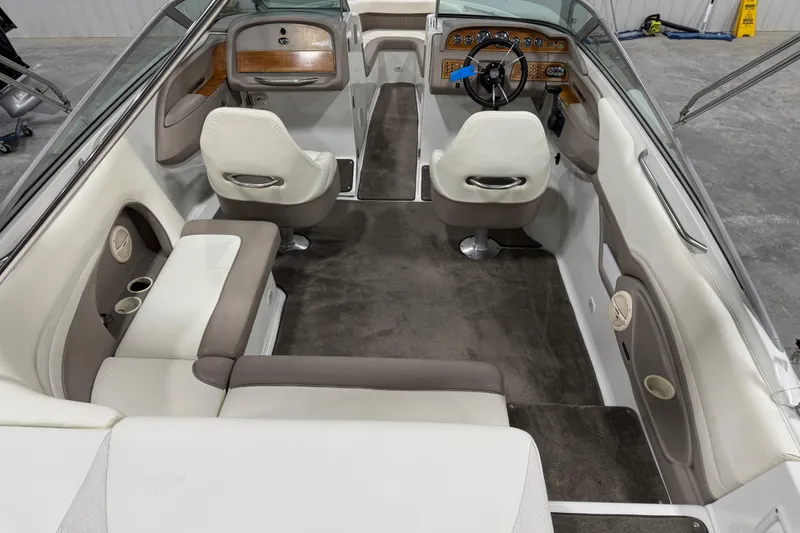 Slide: The Image of Interior of a 2000 Cobalt 246 boat, featuring seating and dashboard. - 7