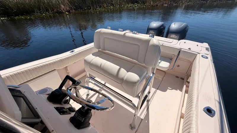Slide: The Image of 2006 Grady-White Chase 273 boat with dual outboard engines. - 10