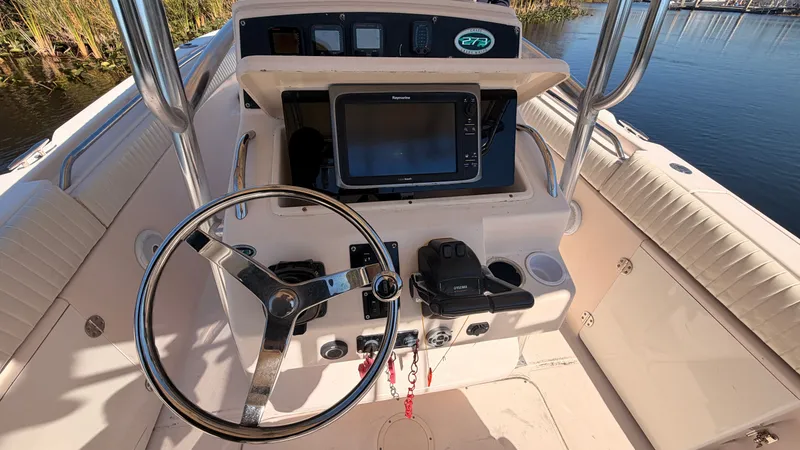 Slide: The Image of Helm console of a 2006 Grady-White Chase 273 boat. - 11