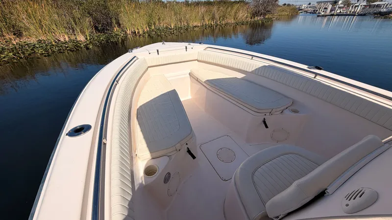 Slide: The Image of 2006 Grady-White Chase 273 boat with seating area by the water. - 14