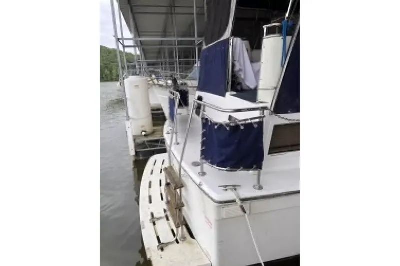 Slide: The Image of 1979 Chris-Craft 350 Catalina docked, featuring blue canvas covers and swim platform. - 4