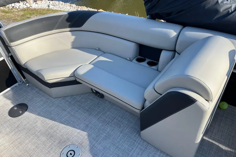 Slide: The Image of 2023 Berkshire 24RFX LE boat interior with gray seating and cup holders. - 8