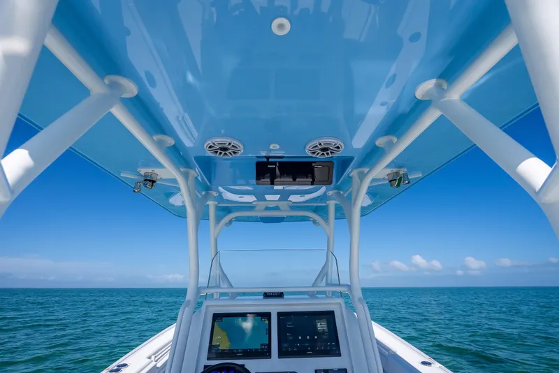 Slide: The Image of 2026 Yellowfin 32 Offshore boat dashboard with ocean view and blue sky. - 17