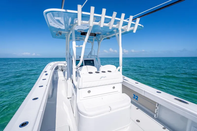 Slide: The Image of 2026 Yellowfin 32 Offshore boat on clear blue ocean waters. - 25