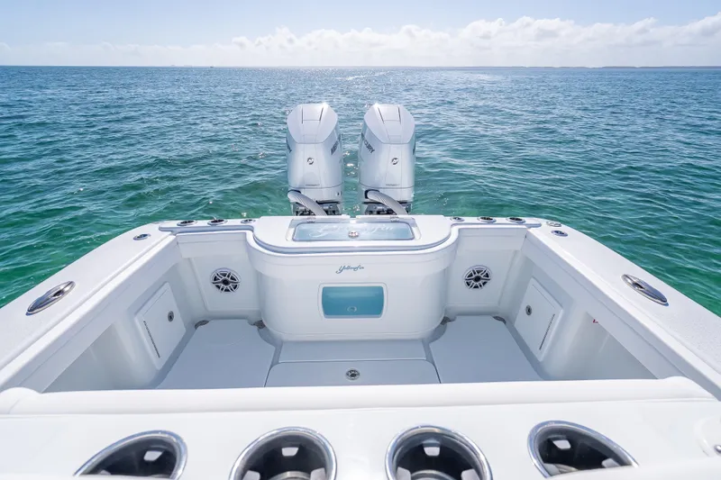 Slide: The Image of 2026 Yellowfin 32 Offshore boat with dual engines on open sea. - 26