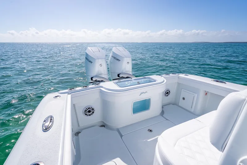Slide: The Image of 2026 Yellowfin 32 Offshore boat with dual Mercury engines on open sea. - 27