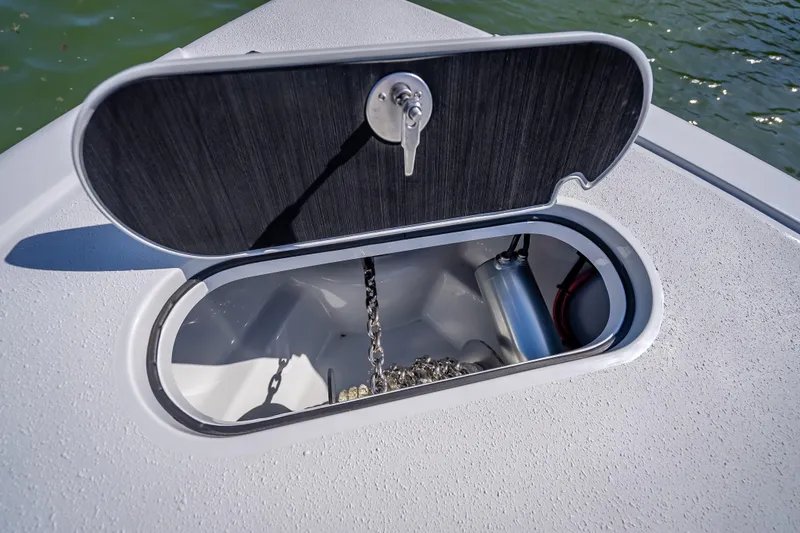 Slide: The Image of Anchor locker of 2026 Yellowfin 32 Offshore boat, open with chain visible. - 37